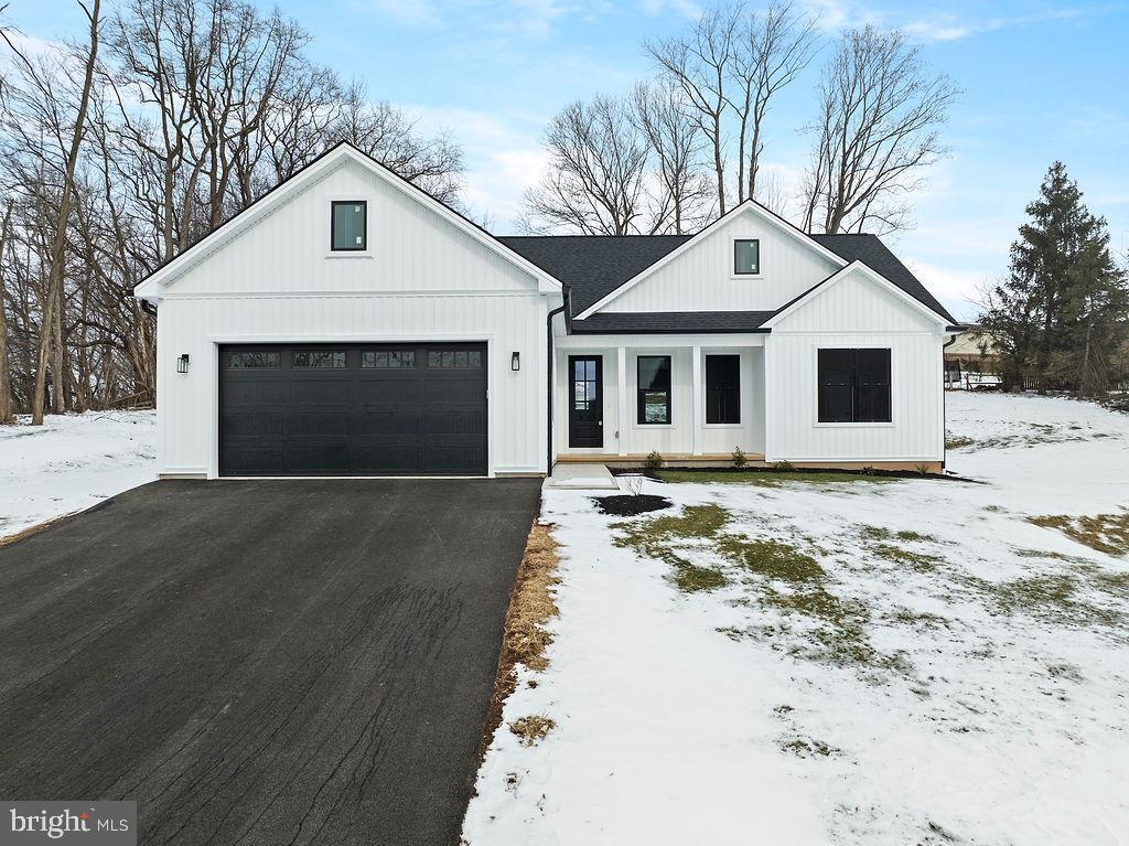 modern farmhouse with a garage