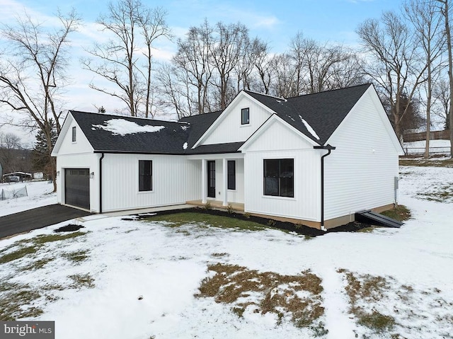 modern farmhouse style home featuring a garage