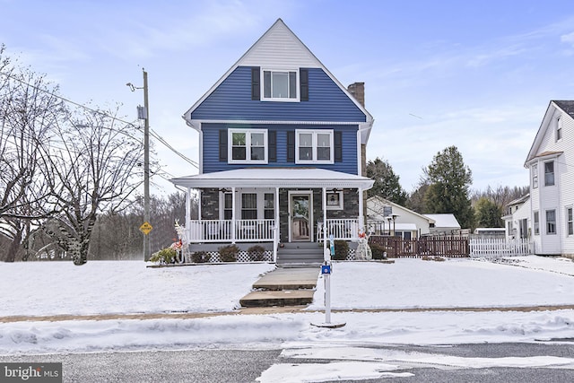 view of front property featuring covered porch