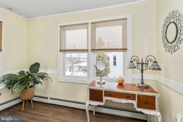 office with a baseboard radiator, a textured ceiling, ornamental molding, and wood finished floors