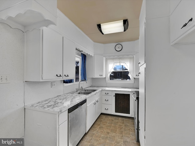 kitchen with sink, white cabinets, and appliances with stainless steel finishes