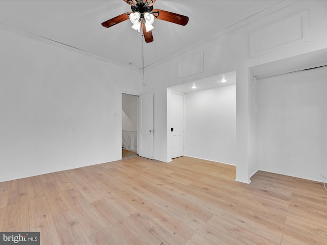 unfurnished room featuring crown molding, ceiling fan, and light hardwood / wood-style flooring