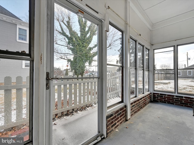 unfurnished sunroom featuring a wealth of natural light