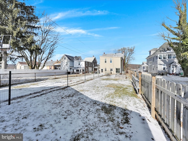 view of yard covered in snow