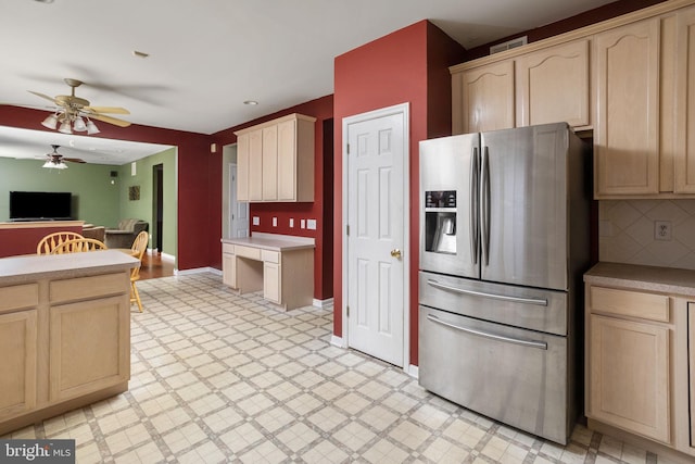 kitchen featuring light floors, light brown cabinets, and stainless steel fridge with ice dispenser