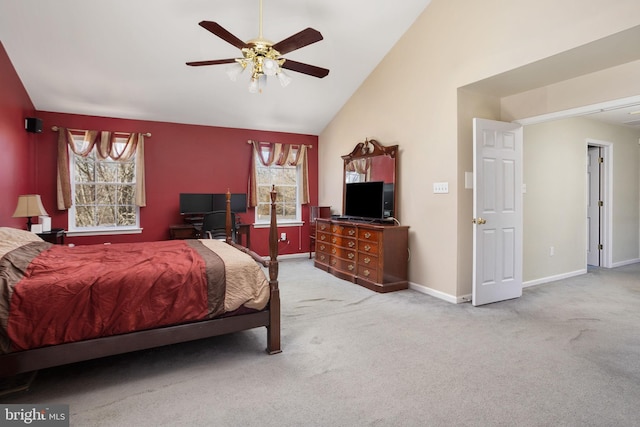 bedroom with carpet floors, multiple windows, and vaulted ceiling