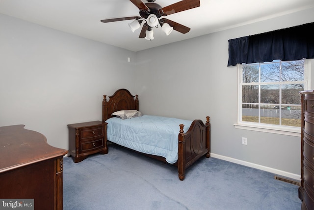 bedroom with a ceiling fan, carpet flooring, visible vents, and baseboards