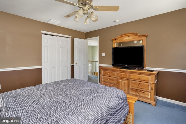 carpeted bedroom with a ceiling fan, baseboards, visible vents, and a closet