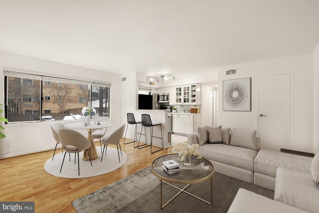 living room with light hardwood / wood-style floors