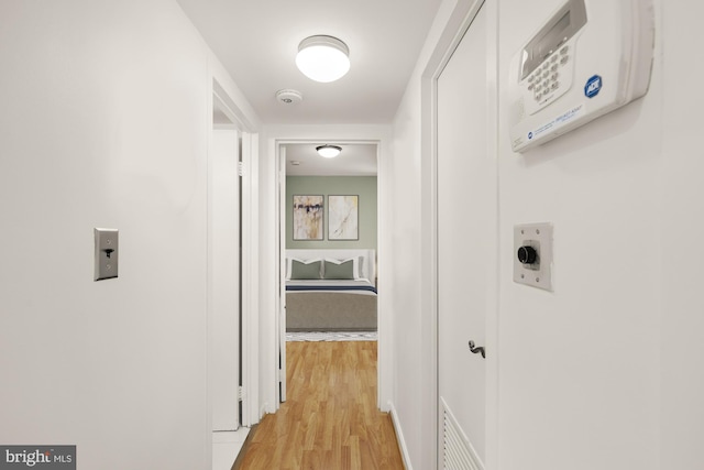 corridor featuring light hardwood / wood-style floors