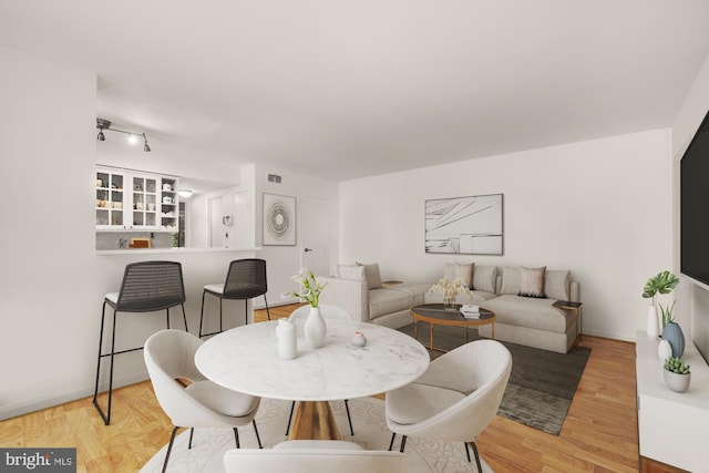 dining room with light hardwood / wood-style flooring