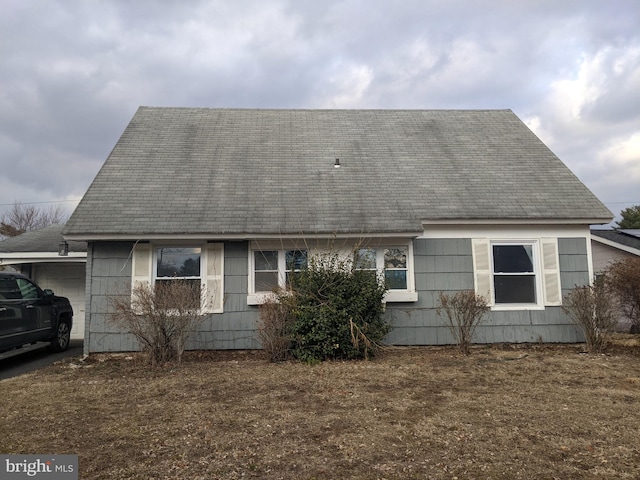 view of side of home featuring a garage