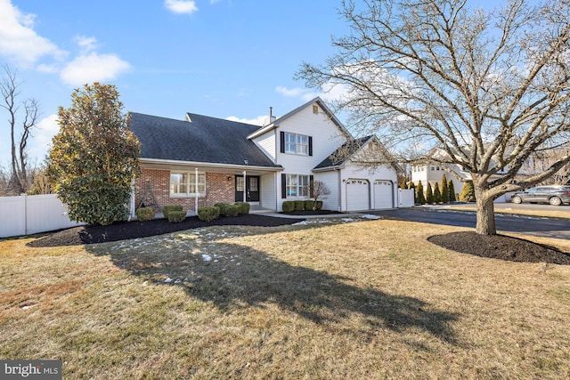 front facade featuring a front yard and a garage