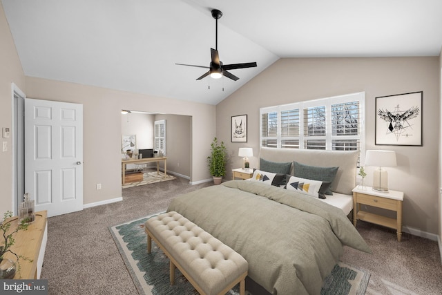 carpeted bedroom with ceiling fan and vaulted ceiling