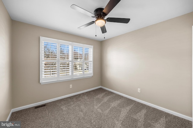 spare room with carpet flooring and ceiling fan