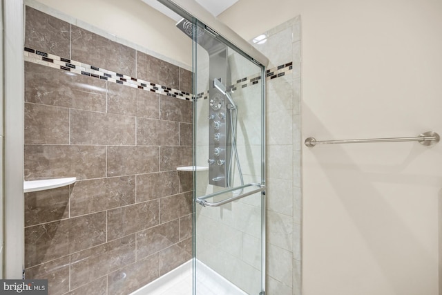 bathroom featuring an enclosed shower