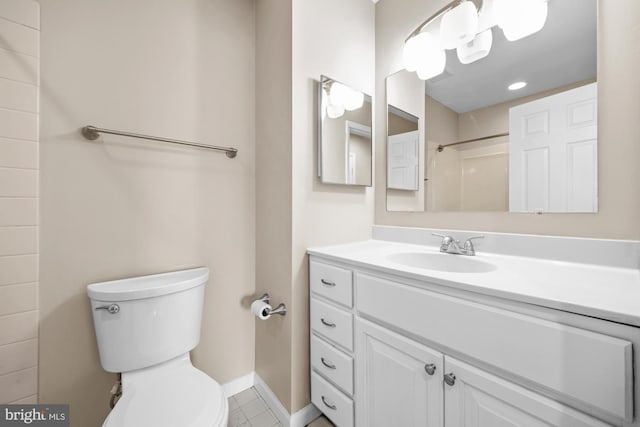 bathroom with toilet, a shower, vanity, and tile patterned flooring