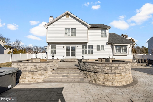 rear view of property with a patio