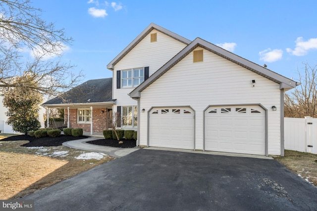 view of front of home featuring a garage and a porch