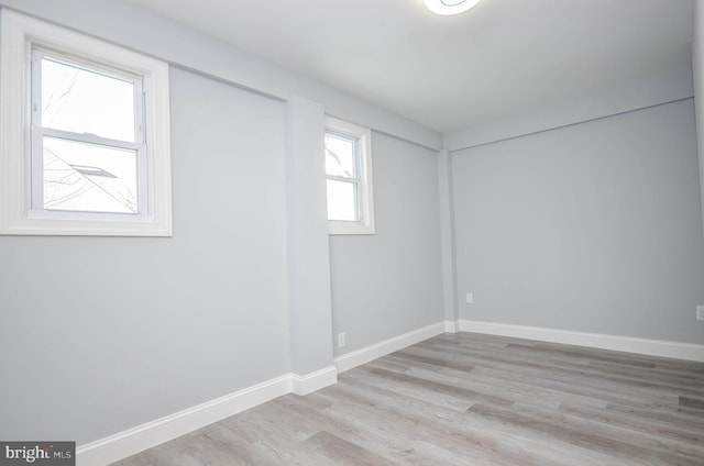 spare room featuring light wood-type flooring