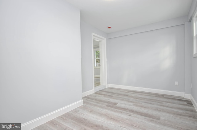 unfurnished room with light hardwood / wood-style floors