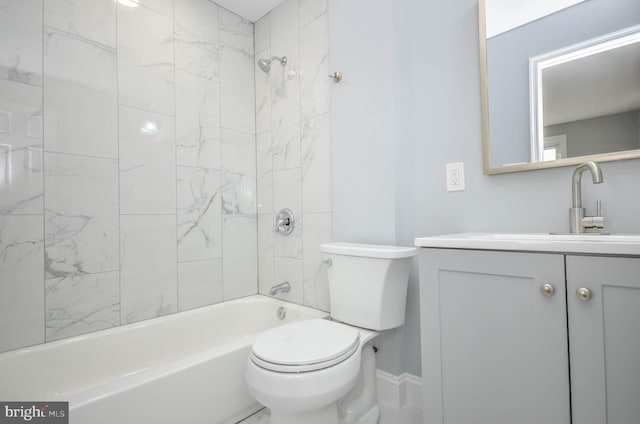 full bathroom featuring vanity, toilet, and tiled shower / bath