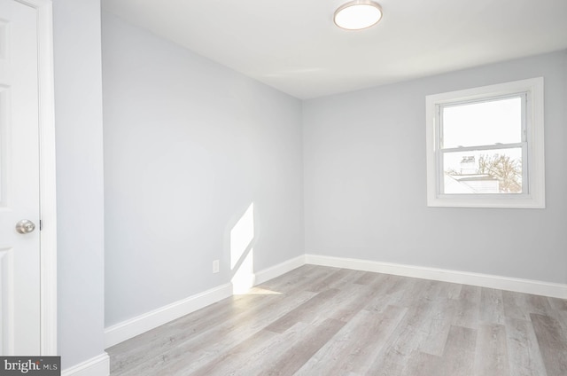 spare room featuring light hardwood / wood-style flooring