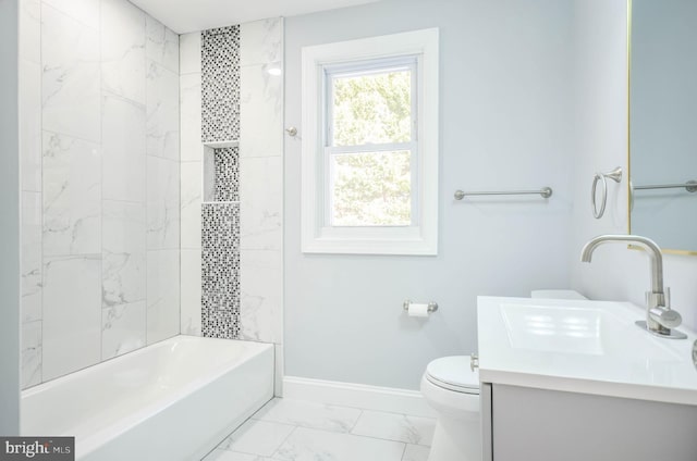 full bathroom with vanity, tiled shower / bath combo, and toilet