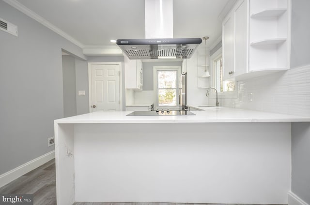 kitchen featuring sink, island exhaust hood, kitchen peninsula, black electric cooktop, and white cabinets