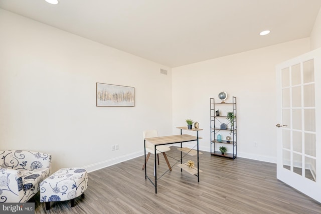 home office with hardwood / wood-style floors