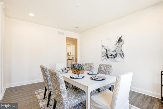 dining room with dark wood-type flooring