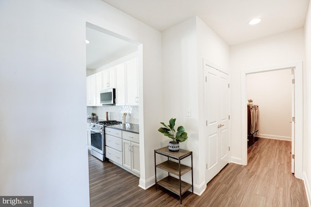 hall featuring separate washer and dryer and hardwood / wood-style floors