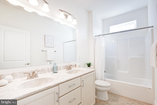 full bathroom with toilet, vanity, tile patterned floors, and shower / bathtub combination with curtain