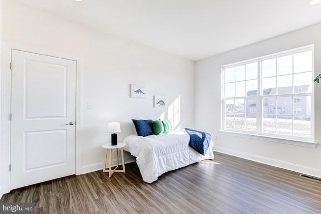 bedroom featuring dark hardwood / wood-style floors