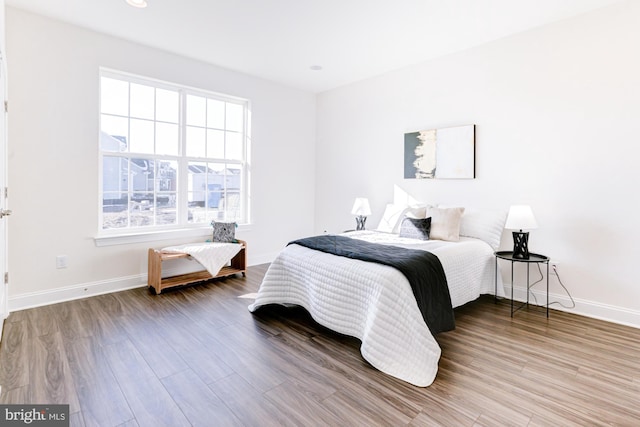 bedroom with wood-type flooring