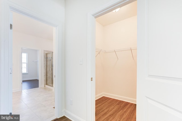 walk in closet featuring light wood-type flooring