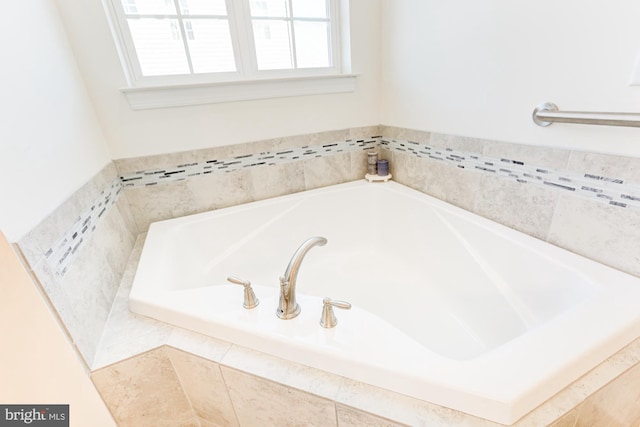 bathroom with tiled bath