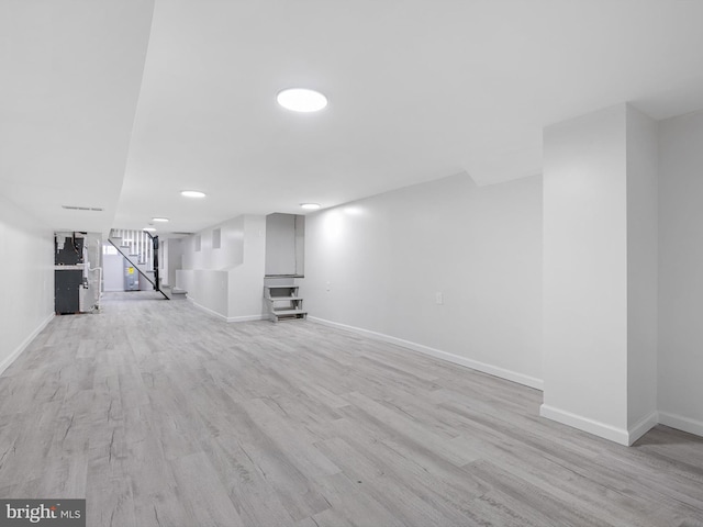 basement featuring light hardwood / wood-style flooring