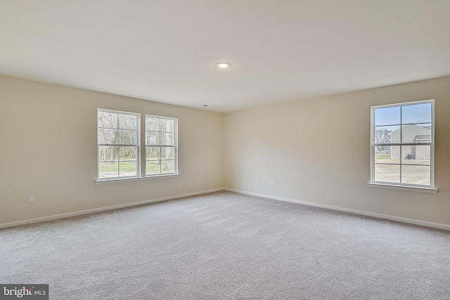 unfurnished room with light carpet