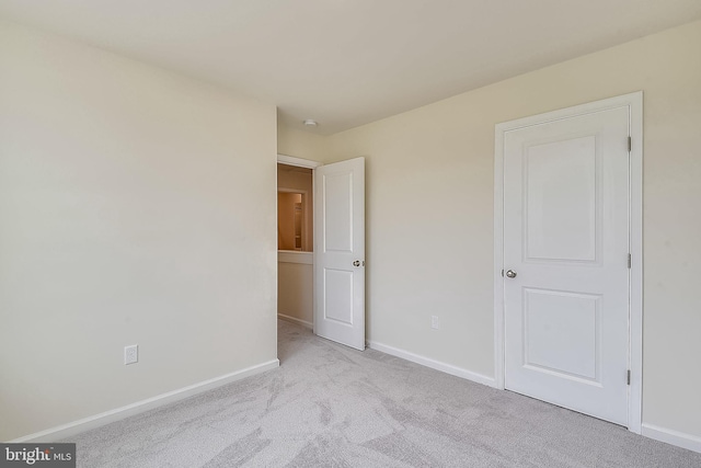 unfurnished bedroom with light carpet