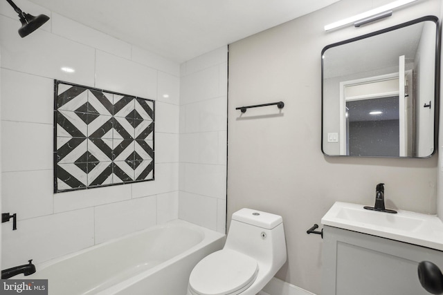 full bathroom featuring toilet, tiled shower / bath, and vanity