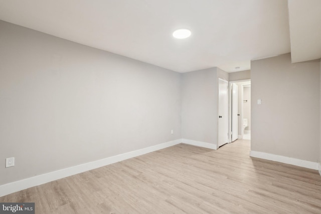 spare room with light wood-type flooring