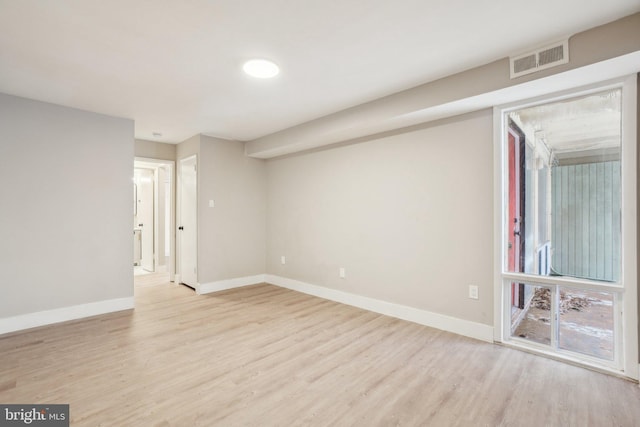 spare room with light wood-type flooring