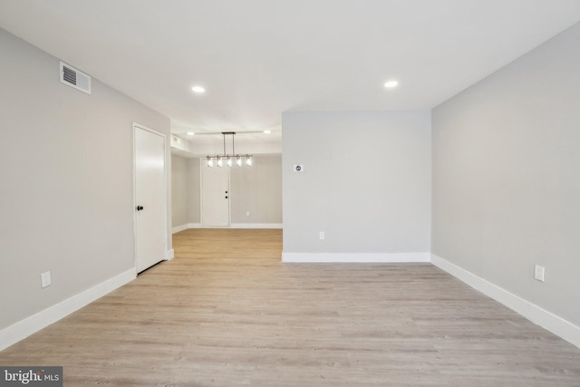 spare room with light wood-type flooring