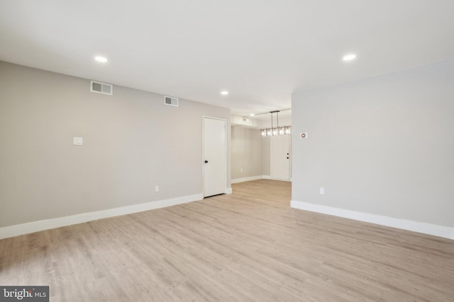 unfurnished room featuring light hardwood / wood-style floors