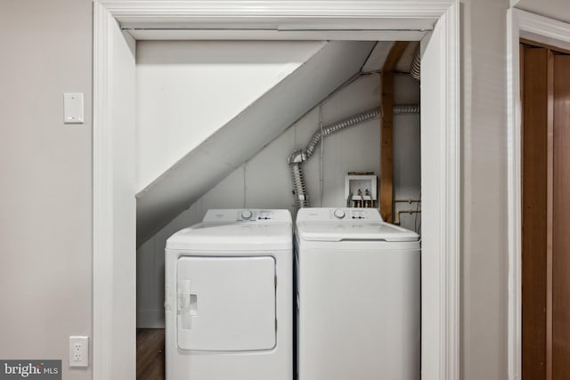 laundry area with washing machine and clothes dryer