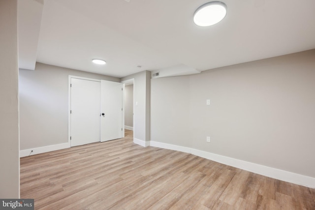 basement featuring light wood-type flooring