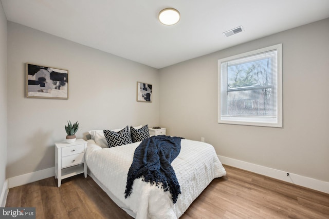 bedroom featuring wood-type flooring