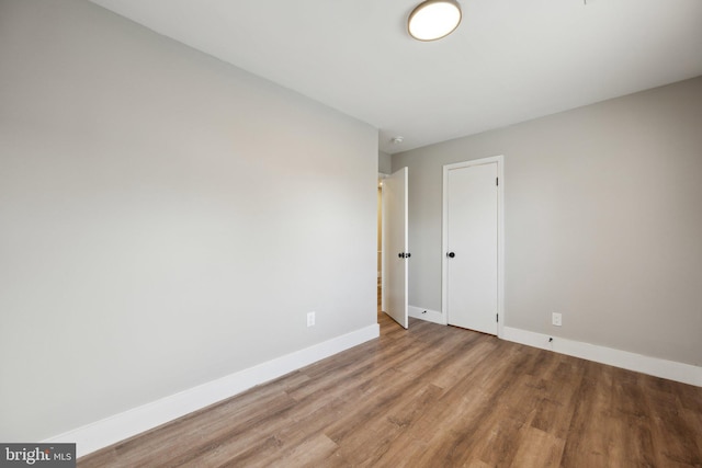 spare room featuring light hardwood / wood-style floors