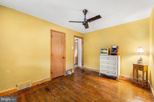 unfurnished bedroom with ceiling fan and hardwood / wood-style floors